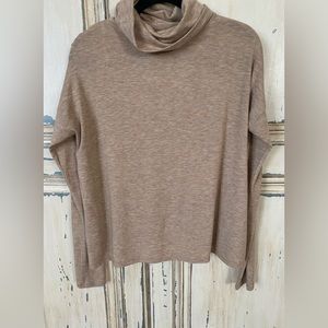 RACHEL ROY BROWN TURTLENECK WITH LEATHER STRIP DOWN THE BACK.